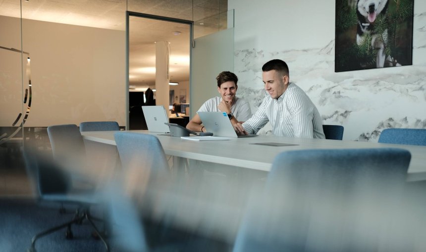 Two Tractive employees going over a project