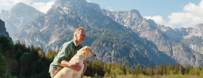 A man and dog in the outdoors