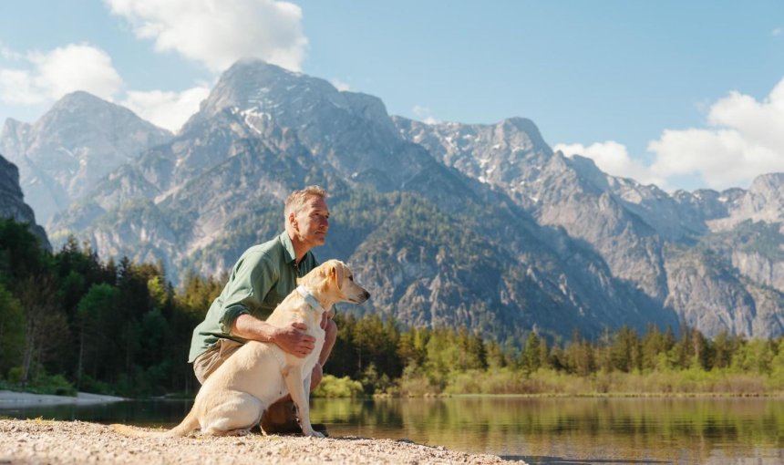 A man and dog in the outdoors