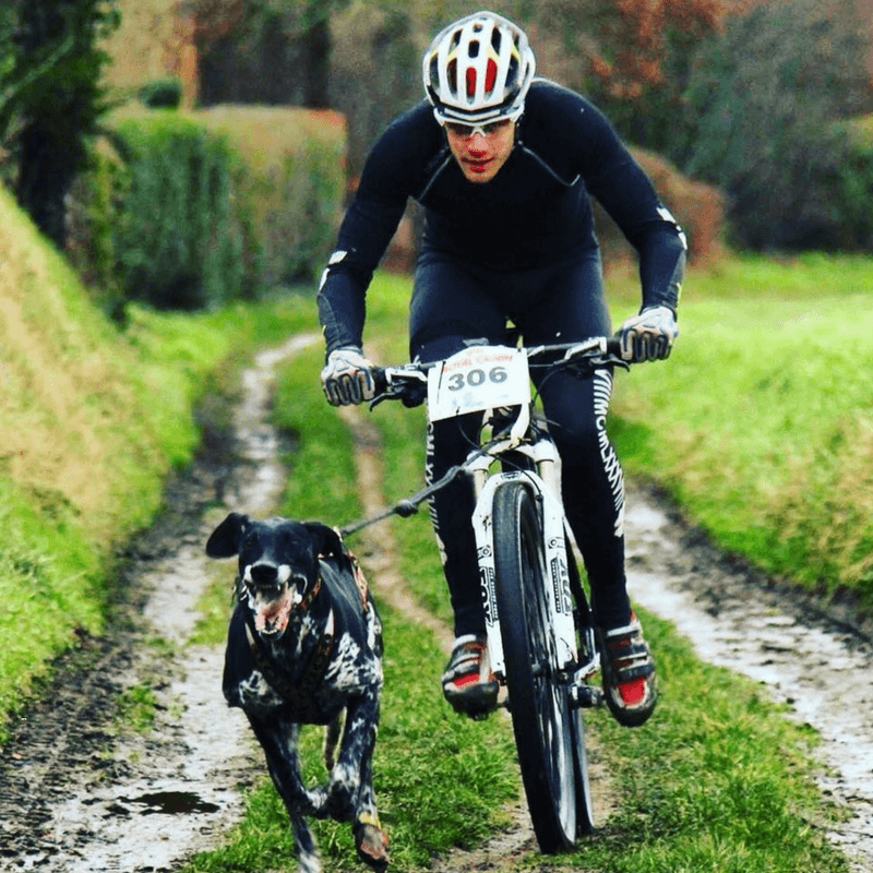 Dog sports champion Jerome Lafourte bikejoring with his dog