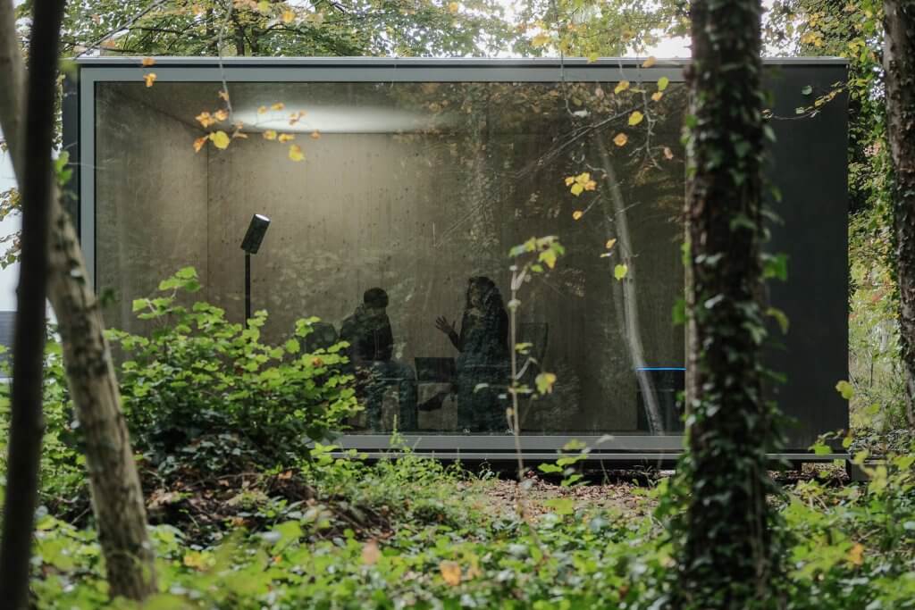 Tractive class container meeting room surrounded by forest