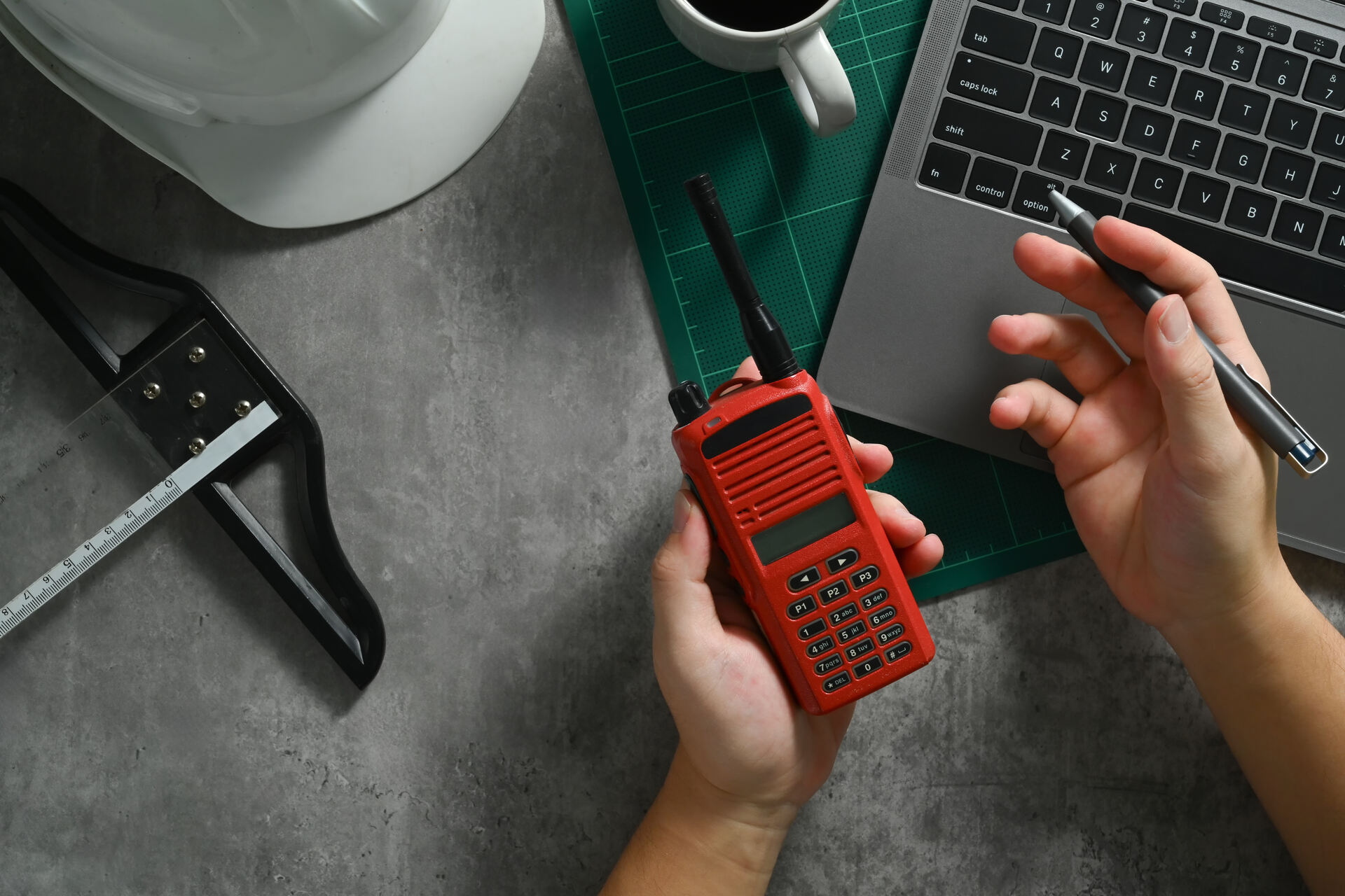 A man holding a radio transmitter 