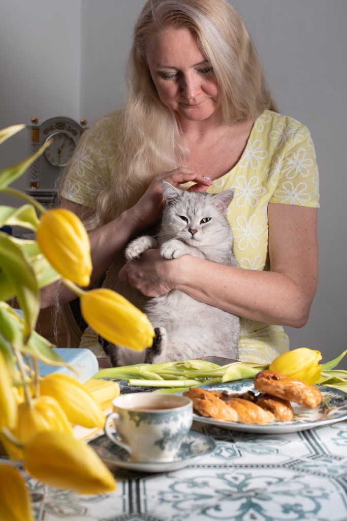 A pet sitter looking after a cat 