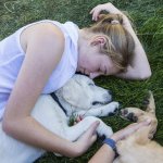 A woman hugging a dog