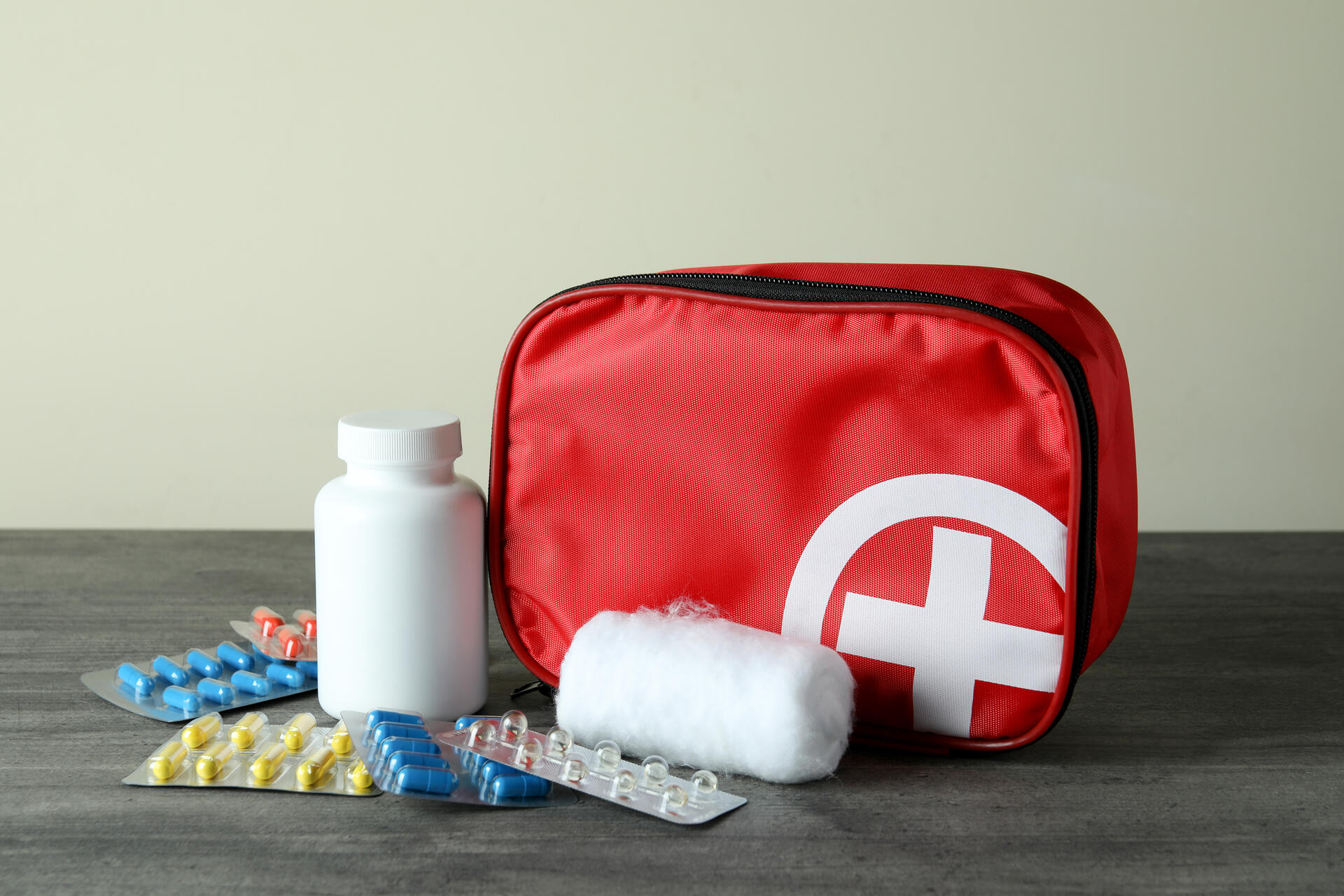 A red dog first aid kit on a table