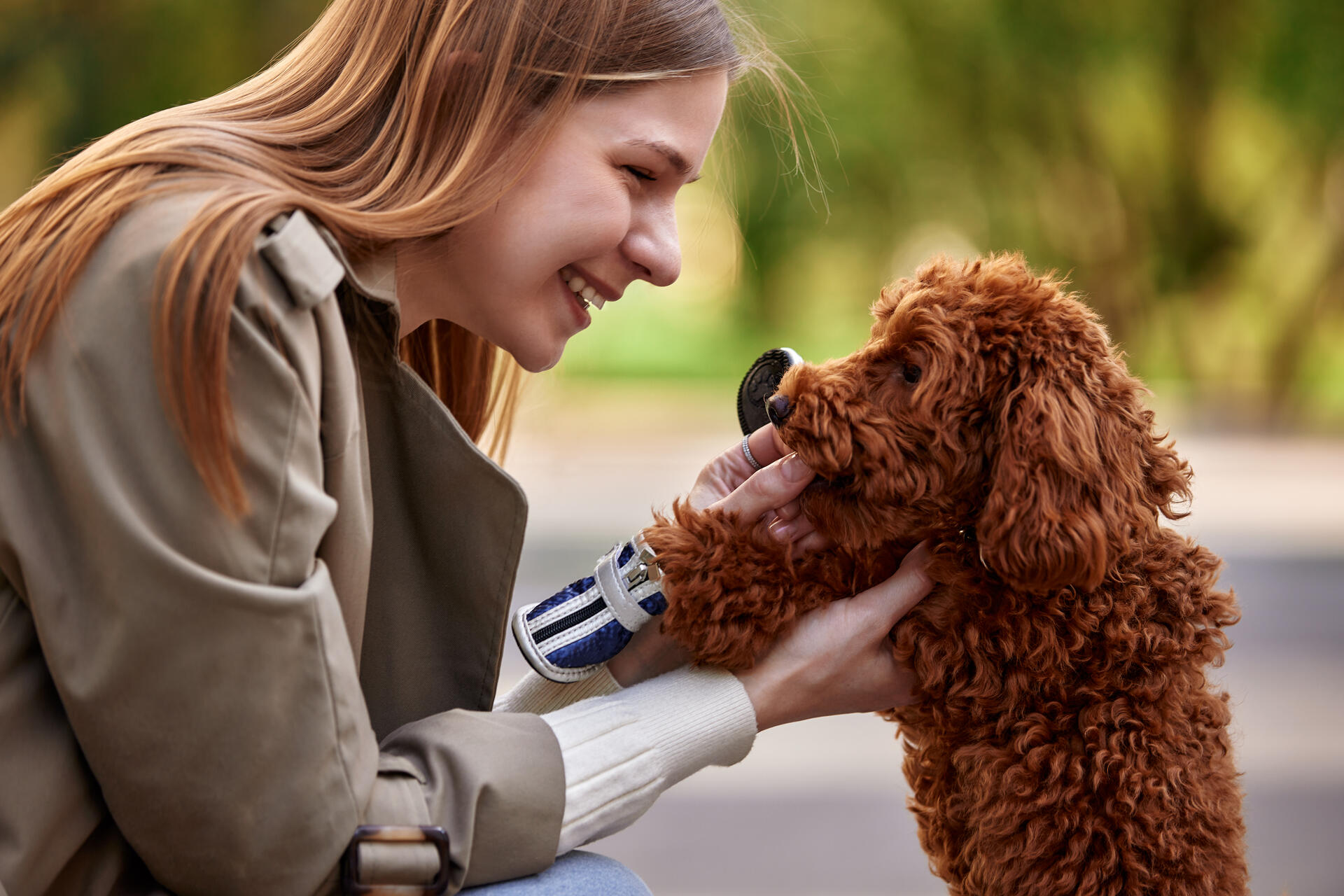 A woman speaking to her blind dog