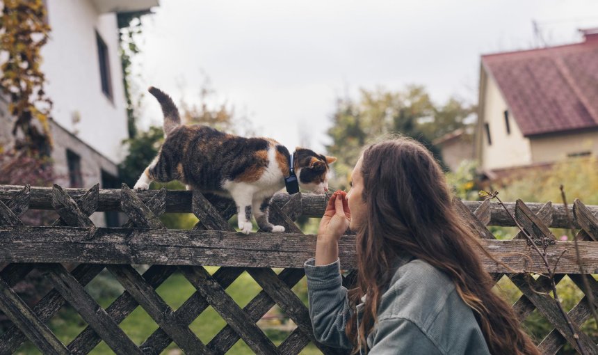woman with cat outside